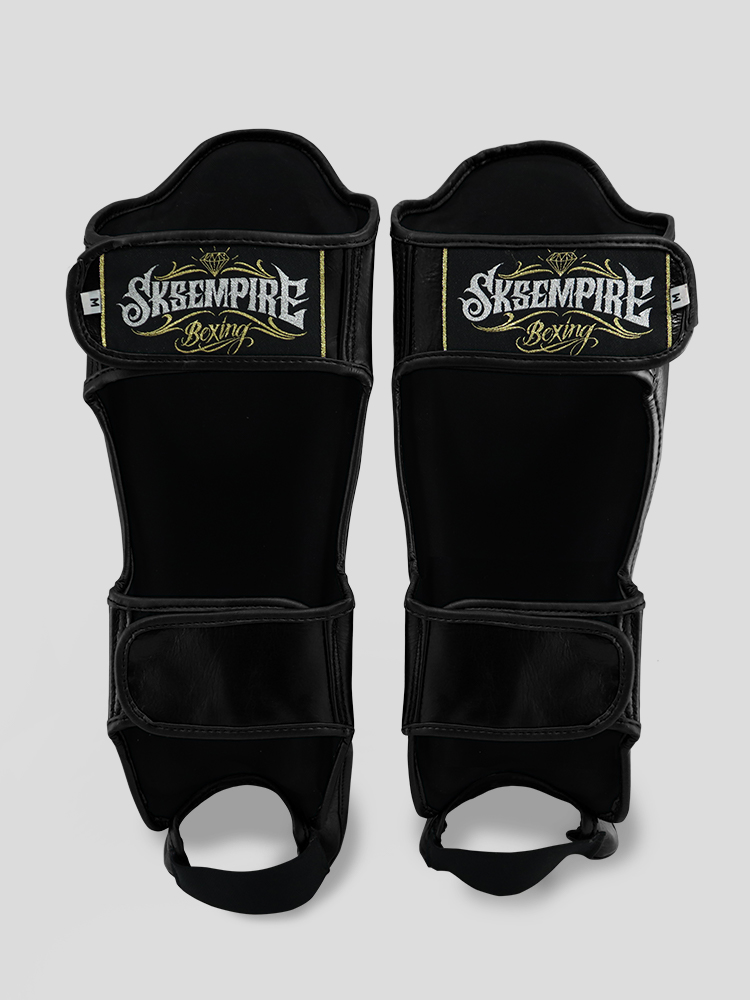 SKS Empire Schienbeinschoner - Echtes Leder - Schwarz / Gold